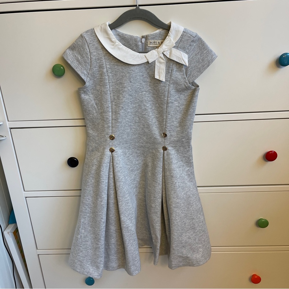 Hope & Henry grey dress with white bow and gold buttons.